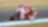Pilote sur une superbike Ducati abordant un virage dans une course