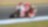 Pilote sur une superbike Ducati abordant un virage dans une course